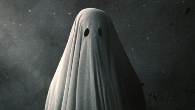 Poster art for 2017 film A Ghost Story featuring a figure draped in a white sheet with eye holes cut out