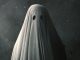 Poster art for 2017 film A Ghost Story featuring a figure draped in a white sheet with eye holes cut out