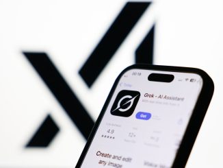 xAI logo displayed on a screen and Grok on App Store displayed on a phone screen