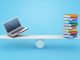 Books balanced on a see saw with a laptop