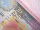 a close-up shot of a UK visa in someone's passport.