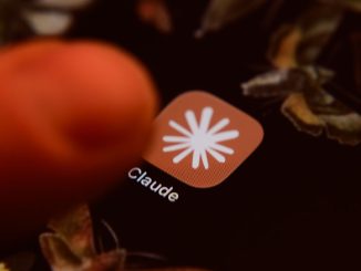 The Claude app icon is displayed on a smartphone screen