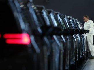 Volkswagen profit falls, revises down full-year revenue outlook