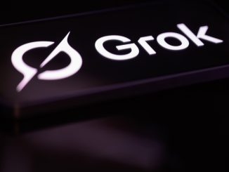 The Grok logo is displayed on a mobile phone screen