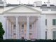 A protective tarp with a photo on it covers the scaffolding and the columns on the North Portico of the White House on July 18, 2026 in Washington, DC..