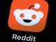 A Reddit app icon on a phone screen.